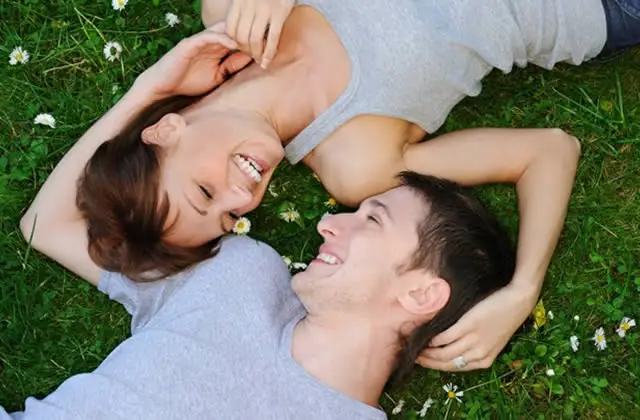 Romantic Love - Romantic lovers resting on grass Romantic Love - Romantic lovers resting on grass