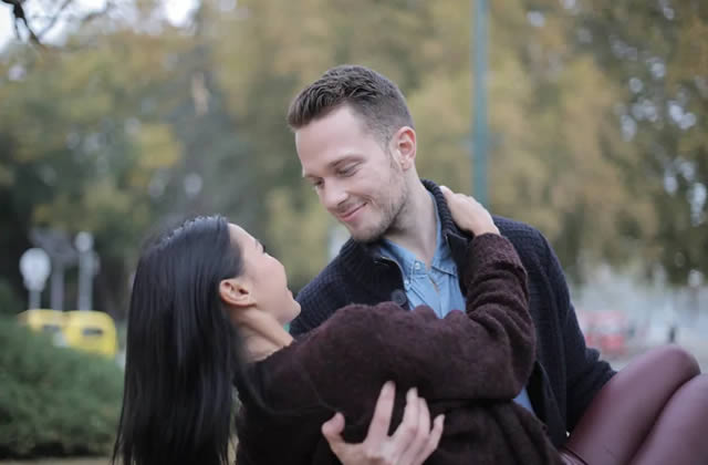 Romantic Love - Young guy carrying his partner in his arms outdoor Romantic Love - Young guy carrying his partner in his arms outdoor