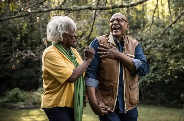 Triangular Theory of Love - Happy elderly Africa-American couple laughing together outdoor Triangular Theory of Love - Happy elderly Africa-American couple laughing together outdoor