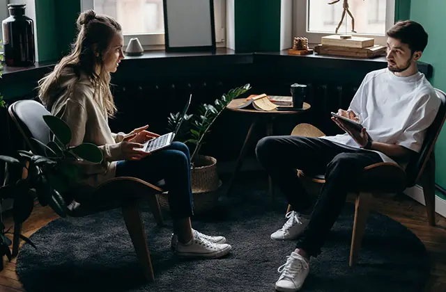 Couple having uneasy conversation Couple having uneasy conversation