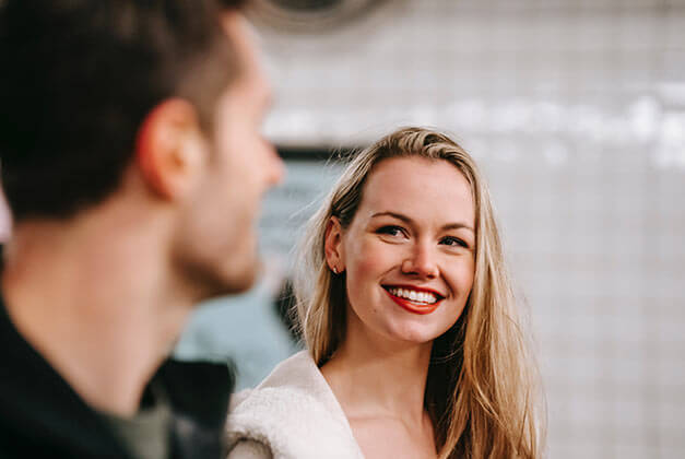 How to Compliment a Guy-Lady approvingly smiling at her guy How to Compliment a Guy-Lady approvingly smiling at her guy