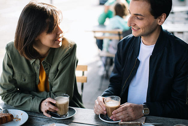 Compliments For Men-Smiling guy having coffee with lady Compliments For Men-Smiling guy having coffee with lady