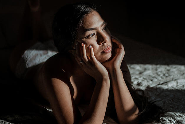 No Contact Rule - Lonely lady looking outside while thinking in her bed No Contact Rule - Lonely lady looking outside while thinking in her bed