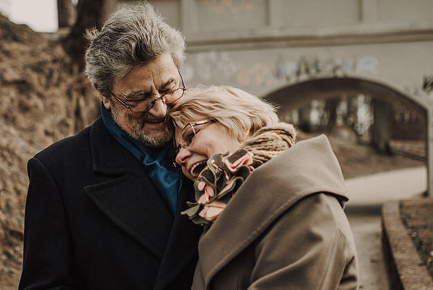 How To Make Your Man Feel Needed - Elderly lady leaning on her man's chest