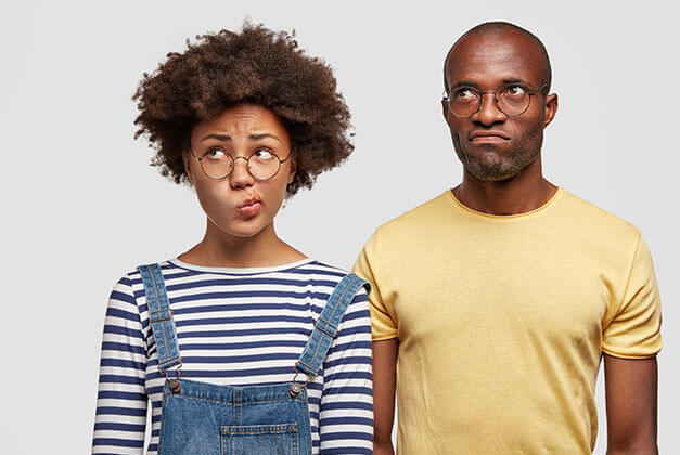 Why Guys Pull Away - Confused couple in glasses looking upwards with rolled eyes Why Guys Pull Away - Confused couple in glasses looking upwards with rolled eyes