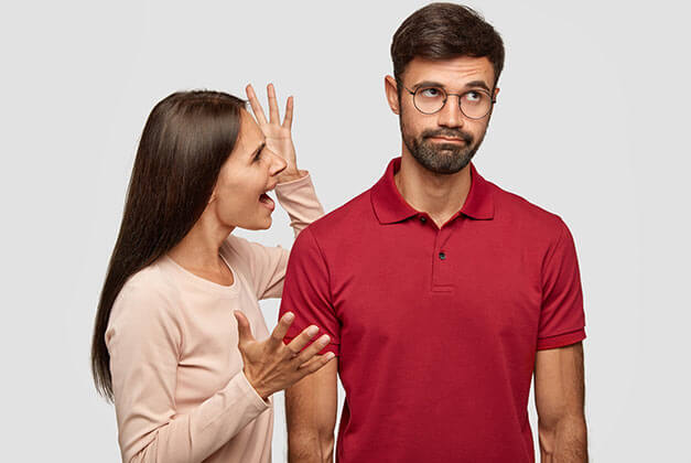 Why Men Leave Women They Love - Confused man looking away from his angry and nagging girlfriend Why Men Leave Women They Love - Confused man looking away from his angry and nagging girlfriend
