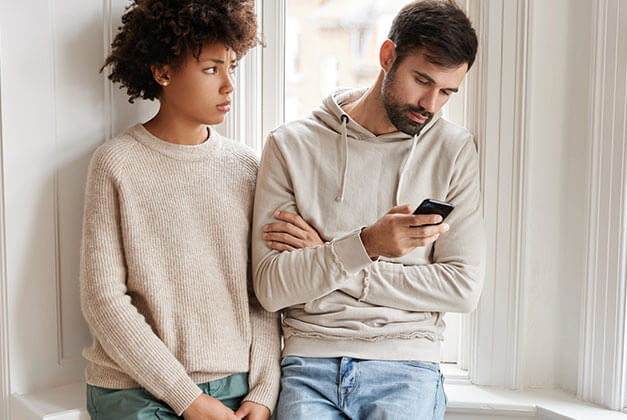 What to Do About Loving a Man Who Doesn't Love You - Sad young lady displeased by her boyfriend neglecting her