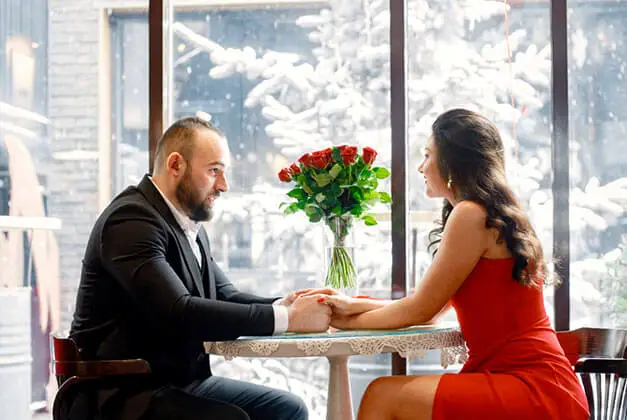 11 Dating Rules for Finding Someone Special Datinge Rules with Couple holding hand at table